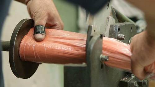 Worker Hands Cutting Bristle using a Bench Shear at the Factory.