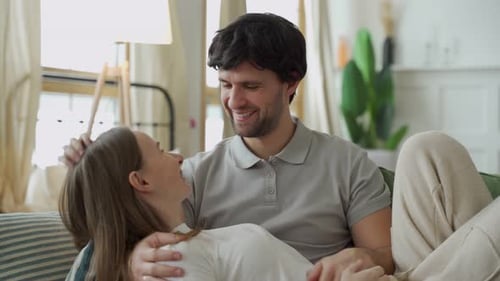 Affectionate Couple Relaxing Together on the Couch