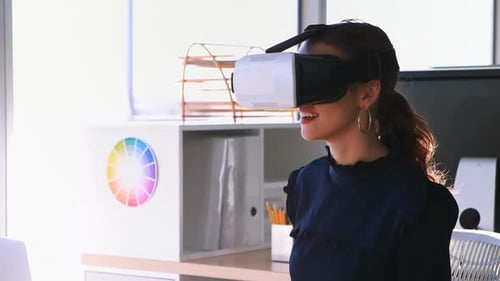 Woman Uses VR Headset in Modern Office