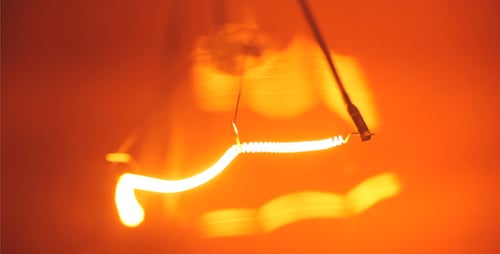 Close Up of Light Bulb Filament Illuminating