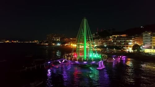 Brightly Lit Landmark Pier at Night Aerial View