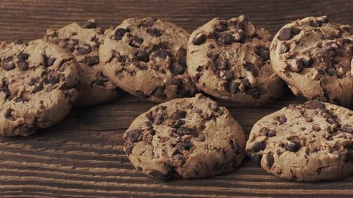 Golden Chocolate Chip Cookies on Rustic Wood Surface