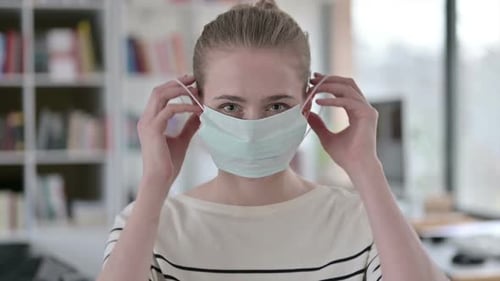 Portrait of Young Woman Wearing Protective Face Mask