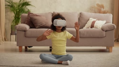 Girl Wearing VR Headset, Sitting Cross-Legged