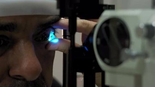 The Ophthalmologist Examines the Patient's Eye Close Up Footage