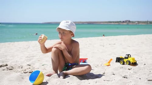 Cute Child in Panama on the Background of the Sea Eating Ice Cream on a Sunny Summer Day