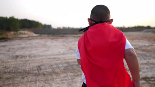 superhero boy running on the field