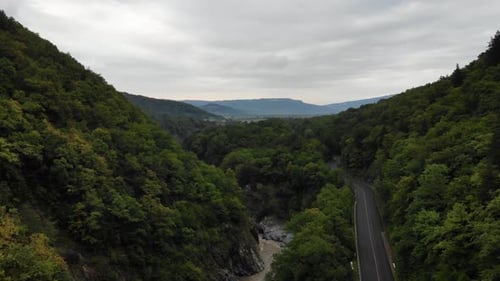 Aerial view to the asphalt road in mountains. Aerial view of the Canyon.