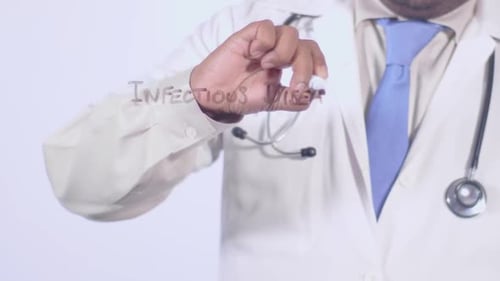 Healthcare Professional Writes Infectious Diseases on Surface