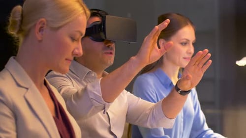 Team with Virtual Reality Headset at Night Office