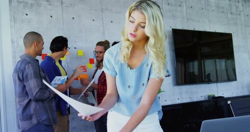 Creative Young Adults Collaborating in Modern Office