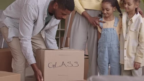African American Family Moving in New Apartment