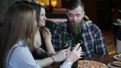 Friends Laugh Drink Beer and Cocktails While Having a Good Time Together at a Bar