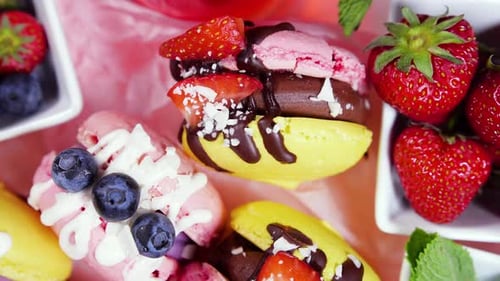Colorful Macarons Decorated with Berries and Chocolate