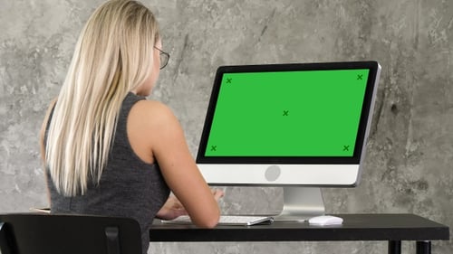 Businesswoman sitting at her desk in the office working