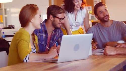 Team Meeting with Laptop in Modern Office