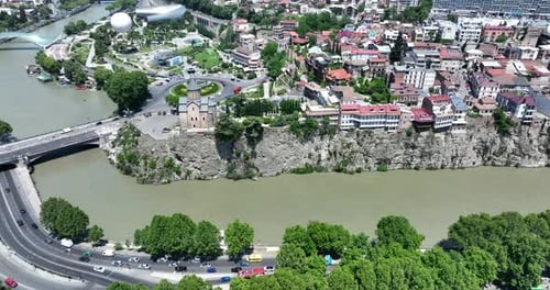 Aerial view of Metekhi church in old Tbilisi located on cliff near river Kura