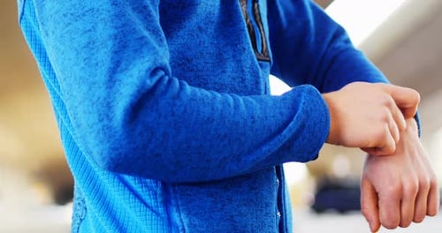 Young man checking his smartwatch in the city, 4K 4k