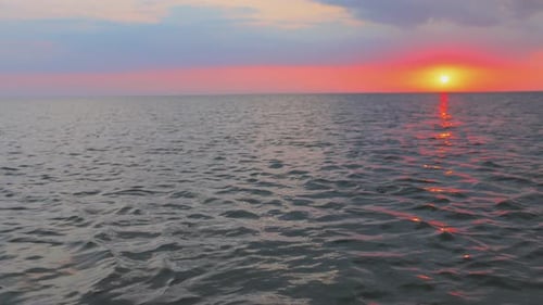 Orange Sunset in the Evening on the Horizon Over the Lake