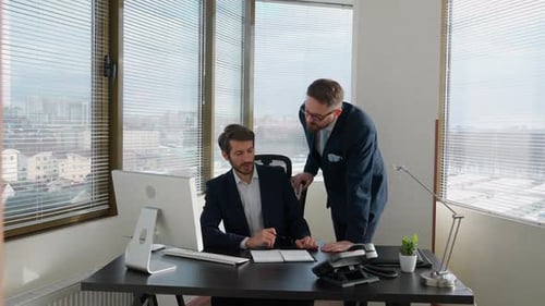 Collaboration in the Office Top Manager and Businessman Planning a Financial Strategy Using a Pc the