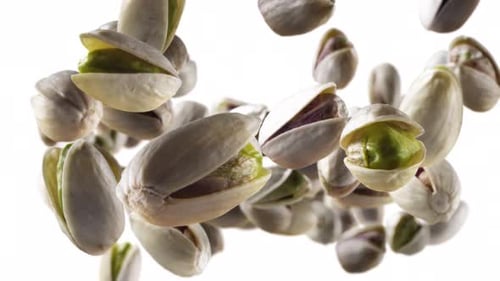 Flying of Pistachios in White Background with Alpha Channel