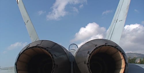 Close View of Aircraft Engines Against Blue Sky