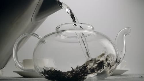 Pouring Hot Water in Glass Teapot, Brewing Tea