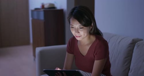 Woman watch on the tablet at home