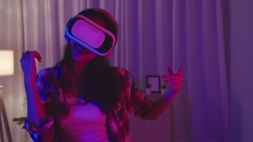 Woman Wearing VR Headset Dancing Indoors