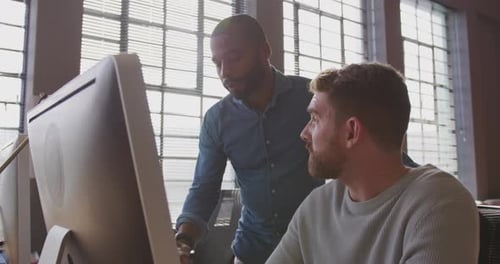 Young creative professionals working in a modern office