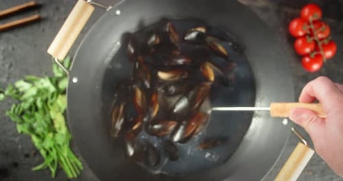 Mussels Being Removed with Skimmer Spoon