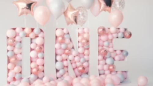 Blurred First Birthday Party Decoration with Balloons