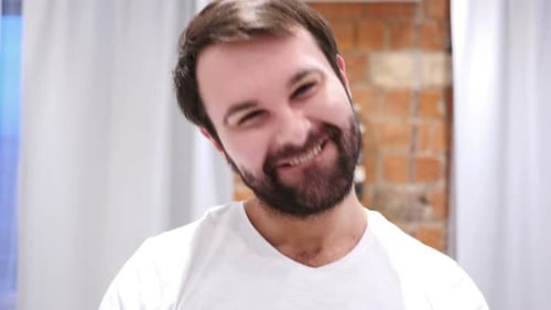 Excited Man Clenching Fists in Joy