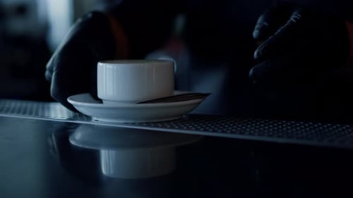 Barista Arms Carrying Fresh Coffee Cup at Cafe Closeup