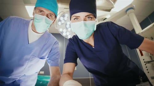 Doctors checking patient at operating room