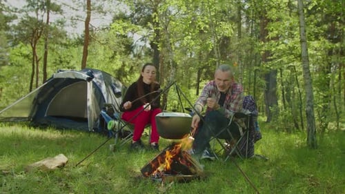 Camping Friends Roast Marshmallows in Forest