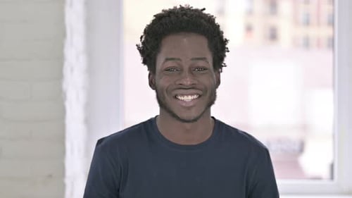 Happy Young Adult Smiling in a Close Up