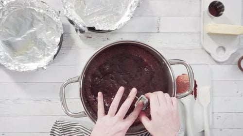 Flat lay. Step by step. Mixing ingredients in the cooking pot to make simple chocolate fudge