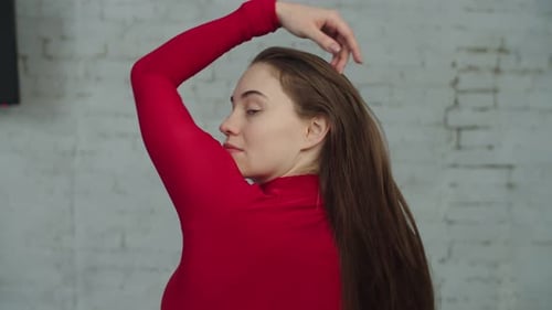 Woman with Brown Hair Posing in Studio