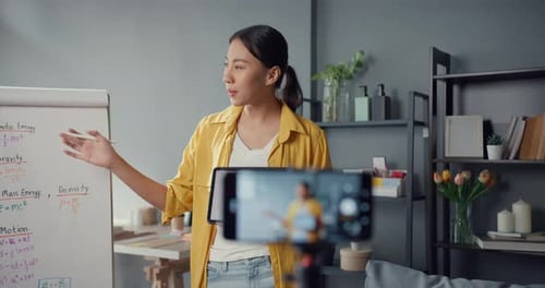 Asia lady teacher video conference calling on smartphone talk by webcam learn teach in online.