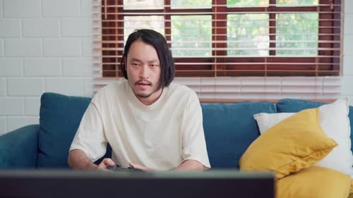 Man Plays Video Games and Celebrates Victory