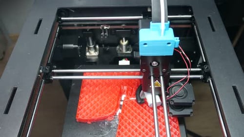 3D Printer Precision Creating Red Plastic Object