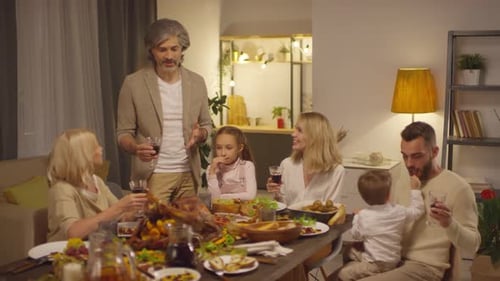 Family Celebrates Together With a Toast at Home