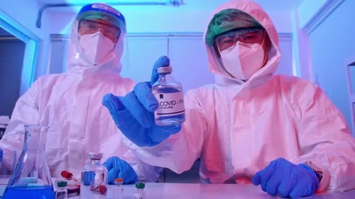 Scientists with COVID-19 Vaccine in Lab