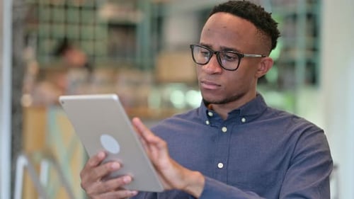 Young Adult Using a Tablet in Office Setting