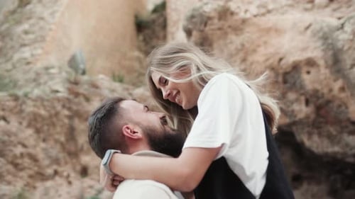 Loving Couple Embraces Outdoors in Natural Setting
