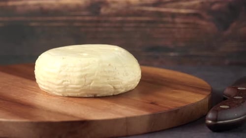 Cheese on Cutting Board with Knife