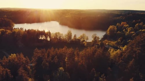 Green Landscape With Lake During Sunset