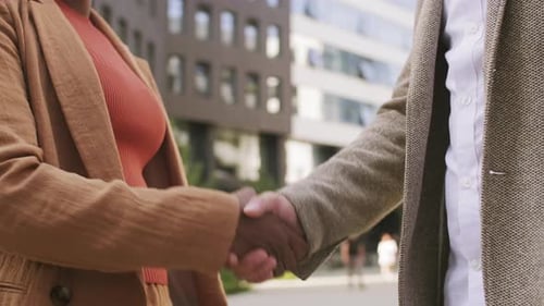 Business Handshake Outside Modern Office Building