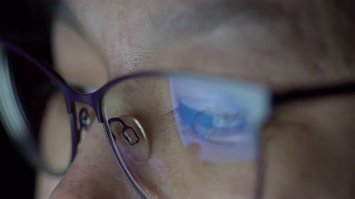 Close-up of Woman's Face with Screen Reflection